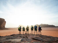 Tourist friends on a top of mountains in a desert. Sunset view. Nature. Tourist people enjoy a moment in a nature. Wadi rum national park - Jordan (Shutterstock/File Photo)
