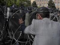 Hundreds of protesters tried to blockade the entrance to government headquarters before riot police intervened (AFP/File Photo)