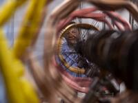 This picture  shows a woman at work in the laboratory of Antico setificio Fiorentino ancient silk factory in Florence. 
Tiziana FABI / AFP