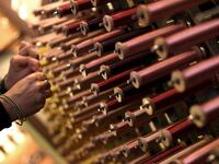 This picture  shows a close-up view of reels of thread in the laboratory of Antico setificio Fiorentino ancient silk factory in Florence. 
Tiziana FABI / AFP