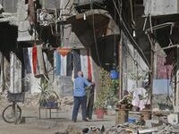 A man stands in a street near destroyed buildings in the Palestinian camp of Yarmuk southern Damascus on November 1, 2018. 
LOUAI BESHARA / AFP