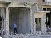 A man stands near a destroyed building in the Palestinian camp of Yarmuk southern Damascus on November 1, 2018. 
LOUAI BESHARA / AFP