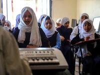 Children attend a music class at the Al-Nawras school in Taez, Yemen's third city, in the country's southwest
AHMAD AL-BASHA / AFP