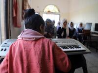 Children attend a music class at the Al-Nawras school in Taez, Yemen's third city, in the country's southwest
AHMAD AL-BASHA / AFP