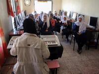 Children attend a music class at the Al-Nawras school in Taez, Yemen's third city, in the country's southwest
AHMAD AL-BASHA / AFP