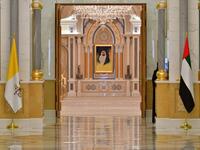 The national flags of Vatican (L) and United Arab Emirates are pictured at the presidential palace in the capital Abu Dhabi during a reception for Pope Francis, on February 4, 2019. 
Giuseppe CACACE / AFP