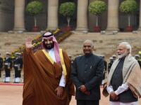 Saudi Crown Prince Mohammed bin Salman (L) waves while posing for media with Indian President Ram Nath Kovind (C) and Indian Prime Minister Narendra Modi during ceremonial reception at Presidential palace in New Delhi 
Prakash SINGH / AFP
