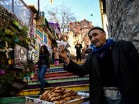 A street vendor sells traditional Turkish backery called "Simit"  in Istanbul's Balat district. 
OZAN KOSE / AFP