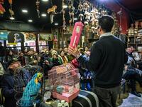 An auctioneer shows items to the audience at an auction house in Istanbul's Balat district.
OZAN KOSE / AFP