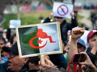 Protesters hold placards during a sit-in against the Algerian presidential bid for a fifth term in office
GERARD JULIEN / AFP
