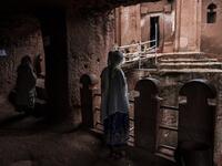 Ethiopian Orthodox devotees stand between the rock-hewn churches of Saint Gabriel and Saint Raphael in Lalibela, Ethiopia
EDUARDO SOTERAS / AFP