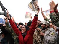 The Military Strongman:

After another brief spell in the US, Haftar returned to Libya and announced that the General National Congress, the country’s elected authority, had been dissolved. Those who opposed him described this as a coup attempt, however he denied the allegation.

(Photo: A woman waves a picture of Haftar. AFP)