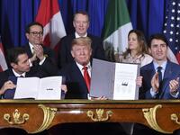 Mexico's President Enrique Pena Nieto (L) US President Donald Trump (C) and Canadian Prime Minister Justin Trudeau, sign a new free trade agreement in Buenos Aires, on November 30, 2018, on the sidelines of the G20 Leaders' Summit. 
SAUL LOEB / AFP
