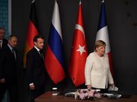 German Chancellor Angela Merkel (R), Russian President Vladimir Putin (2ndL), Turkish President Recep Tayyip Erdogan (L) and French President Emmanuel Macron (C), arrive for a conference during a summit on Syria. (OZAN KOSE / AFP)