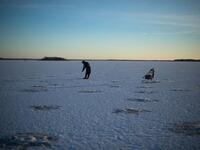 An aerial view of fishing holes bored into the frozen sea on the Gulf of Bothnia, near Vaasa, Western Finland on December 28, 2018, where winter daylight last for some four hours. 
Olivier MORIN / AFP