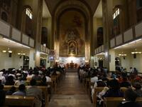 Libya: Christian residents in the country gather to take refuge in Easter solemnities. A Christian Catholic priest kisses the crucified statue of Jesus during Good Friday service.