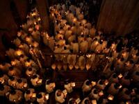 Holy tomb at Jerusalem: Greek Orthodox Patriarch Theofilos III begins the ceremony inside the Holy Sepulchre, the place where Christians believe Jesus was buried.
