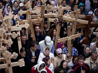 Jerusalem: Roman Catholic clergymen hold crosses as they circle around the Stone of Anointing during the Holy Thursday ceremony at the Church of the Holy Sepulchre in Jerusalem's old city. 