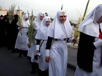 Jerusalem the week before His crucifixion, when a cheering crowd greeted Him waving palm leaves.