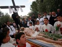 Jesus at Jenin: Palestinian Christians carry a statue of Jesus Christ during the Good Friday procession in the West Bank village of Zababdi.