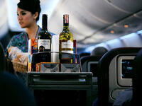 Air attendant serving drinks 