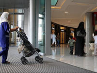 nanny maid child airport scene Arabs