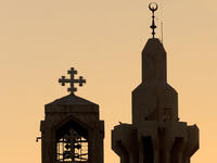 church next to mosque silhouette
