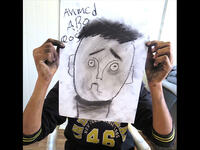 Ahmed nailed the eyebrow lesson, perfectly communicating confusion in his over-sized self portrait. By the end of this session, the black charcoal drawing sticks left the crew looking like coal-miners.