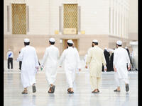 arab men going to pray 