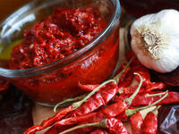 Spice up that shawarma with some shatta (hot sauce) or harissa (hot pepper paste). Steer towards spicy - it increases circulation and makes you sweat, which cools your skin.  It’s no coincidence that some of the hottest places have the spiciest food!. Eat often, but small, because the bigger the meal, the more energy you need to digest it.