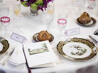 Menu, porcelain plates, glasses and tableware are pictured during the state dinner hosted by the French President for the South Korean President at the Elysee Palace in Paris, France, on October 15, 2018. 
(Christophe Petit-Tesson / POOL / AFP)


