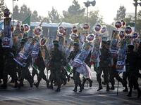 Iranian soldiers play during a parade on the occasion of the country's annual Army Day on April 18, 2018 in Tehran. ATTA KENARE / AFP