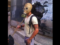 gas mask protester Lebanese trash