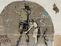 'Stop and Search', mural in the occupied West Bank town of Bethlehem  /AFP