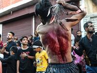 A Kashmiri Shiite Muslim mourner flagellates himself during a religious procession held on the seventh day of Ashura which remembers the slaying of the Prophet Muhammed's grandson in southern Iraq in the seventh century, in Srinagar on September 18, 2018. TAUSEEF MUSTAFA / AFP