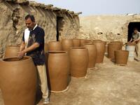 Iraqis making clay pots in Najaf on November 11, 2018. Pottery has deep roots in Iraq, where ancient civilisations turned to clay to build their homes, shape their cooking utensils, and even make their ovens.
Haidar HAMDANI / AFP