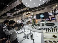 A visitor aims a weapon at the Saudi stand during Egypt’s first Service Defence Exhibition in Cairo on December 3, 2018, at the International Exhibition Center. 
Khaled DESOUKI / AFP