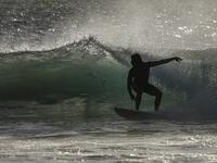 A surfer enjoys the waves at Las Baulas National Marine Park, Playa Grande, Costa Rica on December 10, 2018. David GANNON / AFP