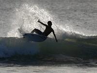 A surfer enjoys the waves at Las Baulas National Marine Park, Playa Grande, Costa Rica on December 10, 2018. David GANNON / AFP