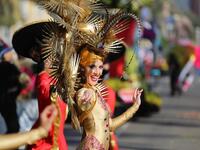 A performer takes part in the Nice Carnival parade on February 16, 2019 in Nice, southeastern France. The 135th carnival runs from February 16 to March 2, 2019, and celebrates this year the "King of Cinema". 
VALERY HACHE / AFP