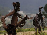 In a celebration of tradition and memory, artist Charles Nassar has been transforming the dark, wrangled remains into sculptures. "I hate shrapnel, but I also love it at the same time," said the 54-year-old sculptor with a neat salt-and-pepper beard, from a garden south of Beirut.
JOSEPH EID / AFP