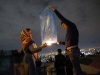 An Iranian couple lights a lantern in a park in Tehran on March 19 2018 during the Wednesday Fire feast, or Chaharshanbeh Soori, held annually on the last Wednesday eve before the Spring holiday of Noruz.
STRINGER / afp
