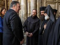 US Secretary of State Mike Pompeo (2nd-L) is greeted by Christian clergymen from various denominations as he visits the Church of the Holy Sepulchre in Jerusalem's Old City on March 21, 2019. 
JIM YOUNG / POOL / AFP