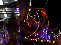 A Palestinian man decorates his shop near the entrance of the Al-Aqsa mosque compound, in the old city of Jerusalem, in preparation for Ramadan. 
AFP/ File Photo