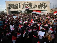 Protestors assemble on April 15 in Bagdad’s Tahir Region to denounce strikes of U.S., Britain and France against Syria. Iraqi and Syria flags are prominently hoisted Ahmad al-Rubaye / AFP