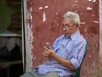 The resident Men in Chairs. Usually hired as “security” or parking lot attendants, these guys can usually be seen sitting in a chair - often missing a leg - on the sidewalk, scowling and muttering at passersby. Sometimes their chair is strategically placed in the street to keep people from parking in front of a store.