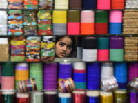 Wearing colorful bangles and putting on Henna during Eid is popular among women in Pakistan. Preparing the perfect outfit continues until the last moment. However, this year’s raising food prices have made it difficult for some to afford the extra expenses. Karachi on June 23, 2017. 