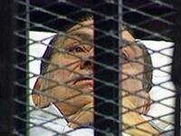 Others were still caged at court for most of Ramadan and Eid we can presume, taking a break from camera and coverage.
The first two court sessions saw the 83-year-old toppled president at court bound to a stretcher and caged.
Now the trial of  Hosni Mubarak and his sons has resumed (today) Monday, September 5, off-camera this time.