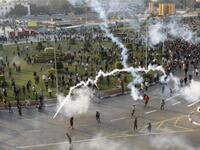 Tear gas smoke fired by Egyptian police is seen as demonstrators gather in central Cairo.
