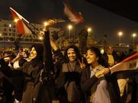 Egyptians celebrate the ousting of Mubarak in Cairo on the night of Friday, February 11, 2011